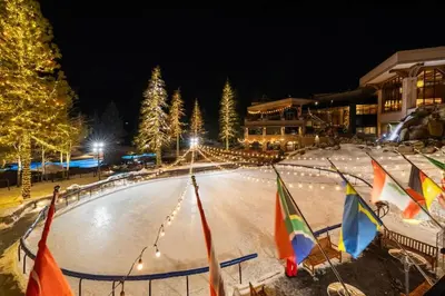 an ice rink at night with flags and lights at Studio Suite 2 Queen Beds Mountain View in Tahoe City