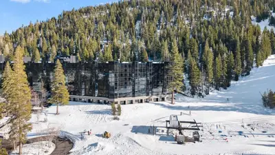 a building on the side of a snow covered mountain at 6th Floor Mountain View Room - Fireplace Suite in Tahoe City