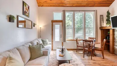 a living room with a couch and a table at Cozy Tahoe Townhome w Fireplace Balcony Quick Access to Trails Lake Cubana - Dollar Hill by AvantStay in Tahoe City