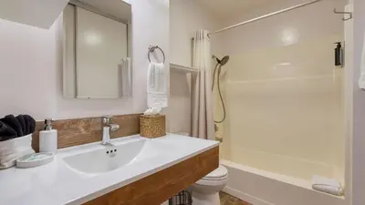 a bathroom with a sink and a shower and a toilet at Cozy Tahoe Townhome w Fireplace Balcony Quick Access to Trails Lake Cubana - Dollar Hill by AvantStay in Tahoe City