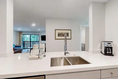a kitchen with a sink and a counter top at Summit 65 in Mammoth Lakes