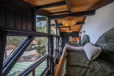 a room with a bed and a large window at Prime Sequoia Stay Pool Hot Tub Sauna Views in Three Rivers