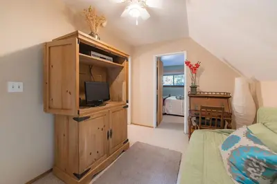 a room with a tv on a wooden cabinet at The Ale Arths Retreat for 8 in South Lake Tahoe