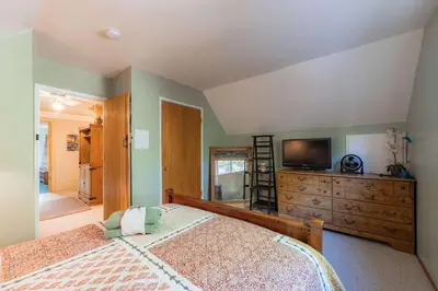 a bedroom with a bed and a television on a dresser at The Ale Arths Retreat for 8 in South Lake Tahoe