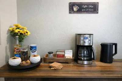 a counter with a coffee maker and a coffeemaker at Yosemite Lodge 5BR Villa Hot Tub Game Room EV in Oakhurst