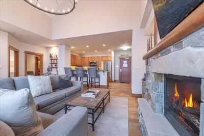 a living room with a couch and a fireplace at Ironhorse Northstar Condo condo in Truckee
