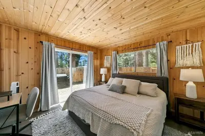a bedroom with a bed and a large window at 3300 Cape Horn home in South Lake Tahoe