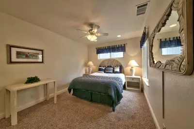 a bedroom with a bed and a large mirror at 1673 Venice Drive home in South Lake Tahoe