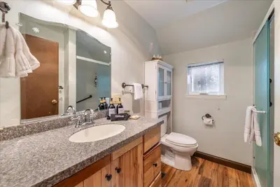 a bathroom with a sink and a toilet at Fred's Retreat cabin in Homewood