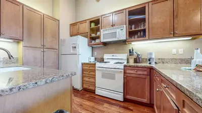 a kitchen with white appliances and wooden cabinets at Snowcreek V #1002 condo in Mammoth Lakes
