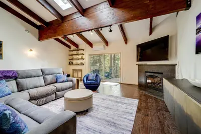 a living room with a couch and a fireplace at All-Season Fun! Family Tahoe North Shore Getaway in Incline Village