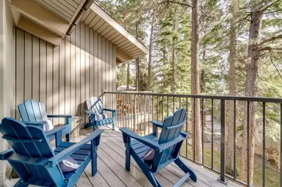 two blue rocking chairs on a porch with trees at All-Season Fun! Family Tahoe North Shore Getaway in Incline Village
