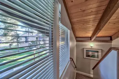 a room with a window with blinds at Lakefront Townhome in South Lake Tahoe in South Lake Tahoe