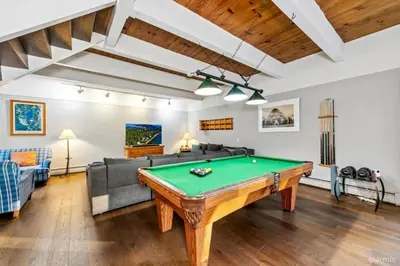 a living room with a pool table at 3748 Terrace Drive home in South Lake Tahoe