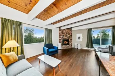 a living room with a couch and a fireplace at 3748 Terrace Drive home in South Lake Tahoe