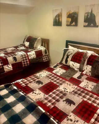 two beds sitting next to each other in a bedroom at 3748 Terrace Drive home in South Lake Tahoe