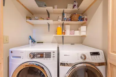 a laundry room with a washer and dryer at Tahoe Pines Beach Retreat home in Homewood