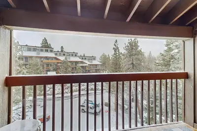 a view from the balcony of a resort in the snow at WilderNest in Stateline