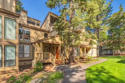 an exterior view of a house with a tree at Kings Beach Luxe in Kings Beach