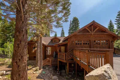 a large wooden house with a large deck at Silverfox at Northstar in Truckee