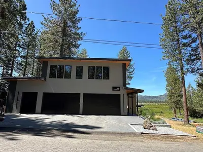 a house with two garage doors in front of it at 676 El Dorado Avenue home in South Lake Tahoe