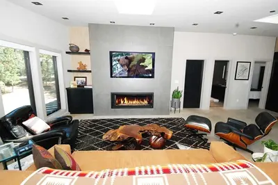 a living room with a fireplace and a couch at 676 El Dorado Avenue home in South Lake Tahoe