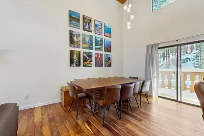 a dining room with a table and chairs at Pine Hill Hideaway in South Lake Tahoe