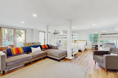 a living room with a couch and a bunk bed at Lakeview Getaway at Rubicon Bay in Tahoma