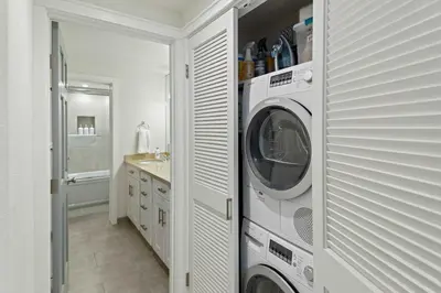 a white washer and dryer in a bathroom at Luxury 3BR 3BA Condo Steps from Canyon Lodge Lift in Mammoth Lakes