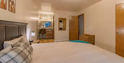 a bedroom with a large bed in a room at Oglala Little Lodge - For 4 in South Lake Tahoe
