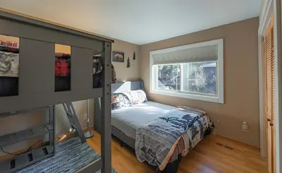 a bedroom with a bunk bed and a window at Bakersfield Basecamp - Meyers Escape in South Lake Tahoe