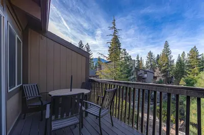 a porch with two chairs and a table on a balcony at Spooner Summit For 6ppl in Zephyr Cove