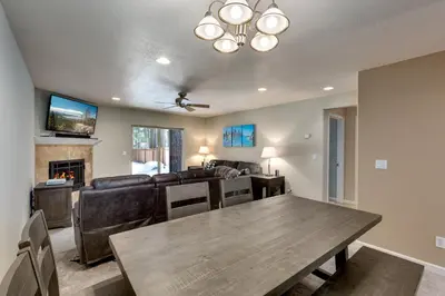 a dining room with a table and a couch at Meadow Chalet townhouse in South Lake Tahoe