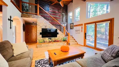 a living room with a couch and a table at Cozy Cabin and Modern Stay in Arnold Near Bear Valley in Arnold