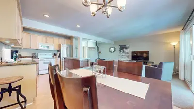 a kitchen and dining room with a table and chairs at Western Slopes Villas #7 condo in Mammoth Lakes