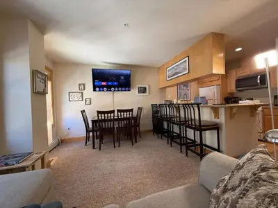 a living room with a kitchen and a dining room at Family Ski Getaway in Kirkwood