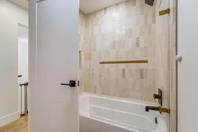 a bathroom with a shower with tiled walls at Walk to Gondola Truckee Retreat with Resort Perks! in Truckee