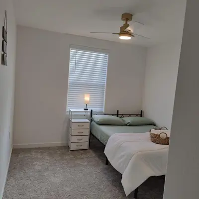 a bedroom with two beds and a window at The Orchid house !! Your home away from home Gateway to Yosemite & UC Merced this for a Room in Merced