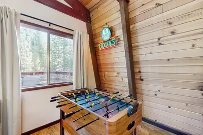 a wine tasting room with a wooden wall at Charming Cabin in South Lake Tahoe