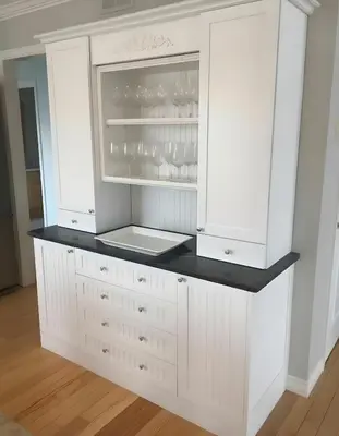 a white kitchen with white cabinets and a refrigerator at PINECREST MAMMOTH LAKES in Mammoth Lakes