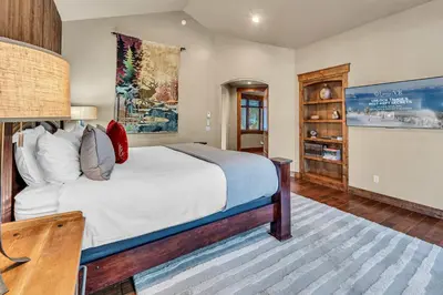 a bedroom with a large bed and a desk at South Lake Tahoe Escape - Private Hot Tub Pool in South Lake Tahoe