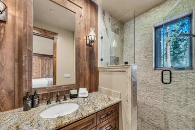 a bathroom with a sink and a mirror at South Lake Tahoe Escape - Private Hot Tub Pool in South Lake Tahoe
