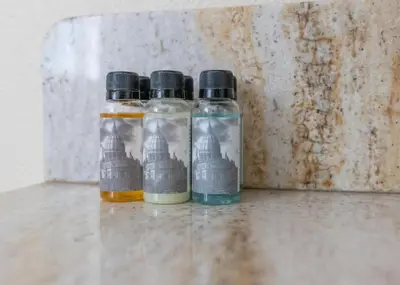 two bottles of oil and vinegar sitting next to a wall at Hot Tub and Game Room 15 mi to Yosemite South Gate in Oakhurst