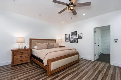 a bedroom with a bed and a ceiling fan at Kinslee Suite at The Four Daughters Inn in Oakhurst