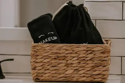 a basket with two black towels sitting on a counter at Kinslee Suite at The Four Daughters Inn in Oakhurst
