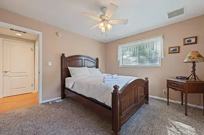a bedroom with a bed and a ceiling fan at Harmony Home- EV Charger in Oakhurst