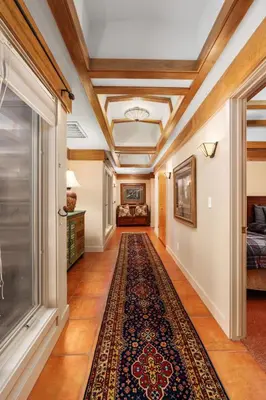 an empty hallway with a rug on the floor at Single level Family cabin-Fenced in yard for pets & kids in Shaver Lake