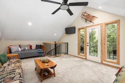 a living room with a ceiling fan and a couch at Cedar Horn- Serene Family Shaver Retreat in Shaver Lake