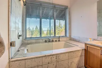 a bath tub in a bathroom with a window at A Quiet Escape in Truckee