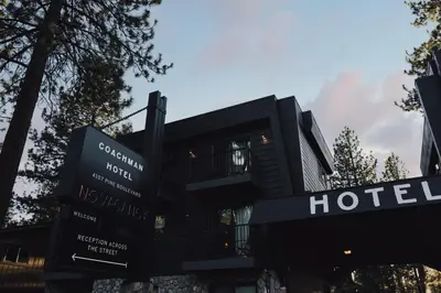 a hotel sign in front of a building at The Coachman Hotel in South Lake Tahoe